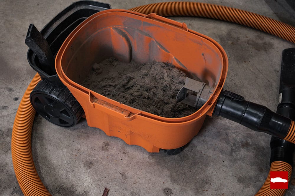 Car detailing vacuum filled with dirt