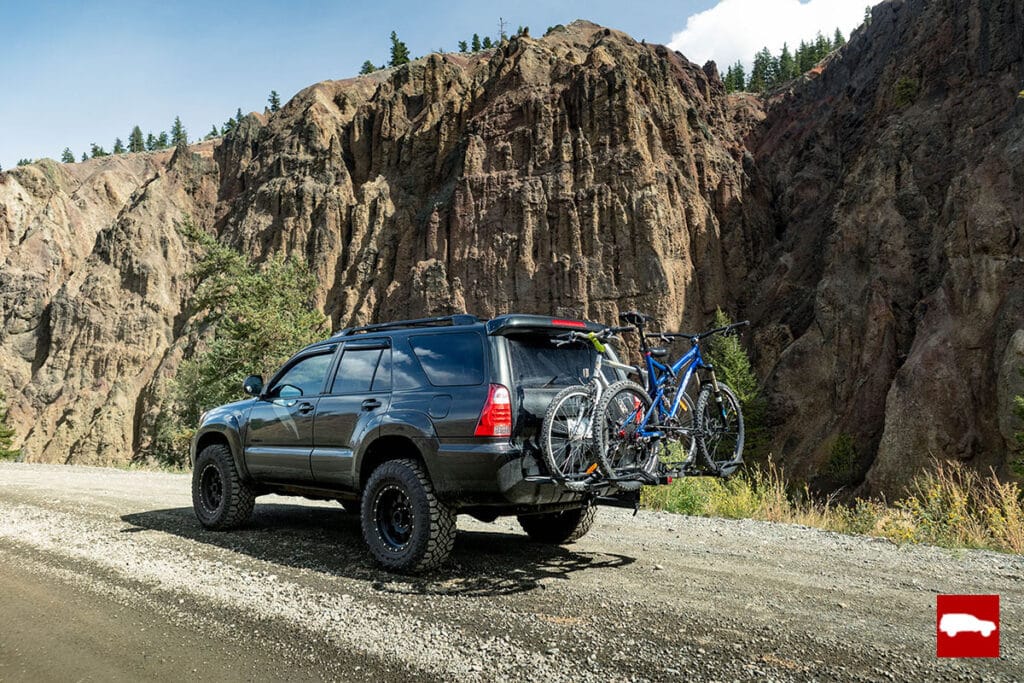 Gray 4runner in front of a cliff